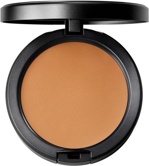 A round compact with a beige powder inside, black lid open, used for makeup.