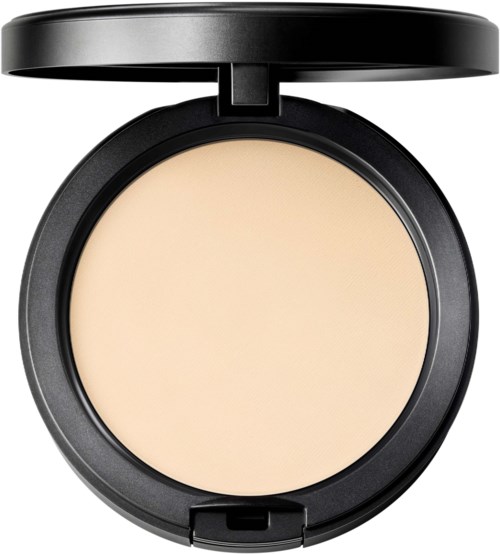 A round compact with beige powder and a black lid open. No visible makeup brush or applicator.