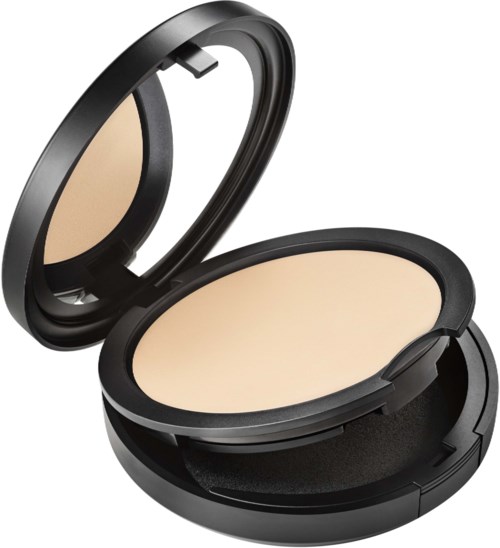 A compact, black makeup powder case with mirror, open to show beige powder inside.