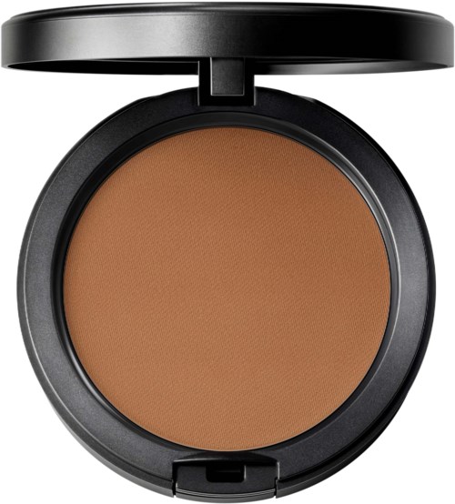 A round makeup compact with a tan powder inside and a black lid.