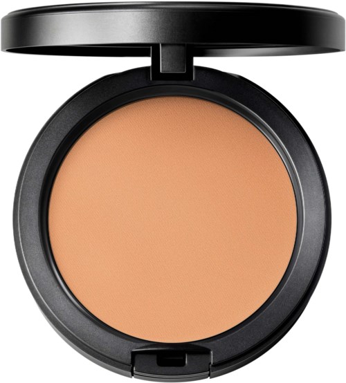 A black round compact with beige pressed powder inside and a flip-up lid.