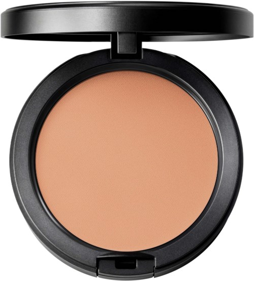 A round makeup compact with beige powder and a black lid that opens.