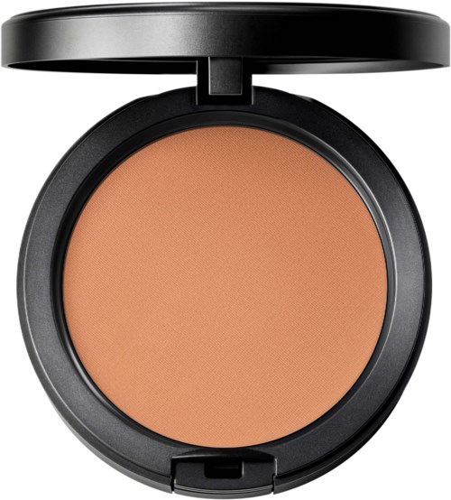 A compact of pressed powder makeup in a black round case with lid open.