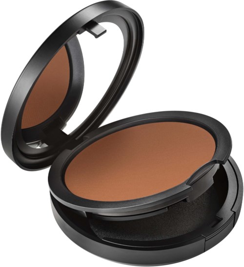 A compact makeup powder in a round black case with a mirror inside the lid.