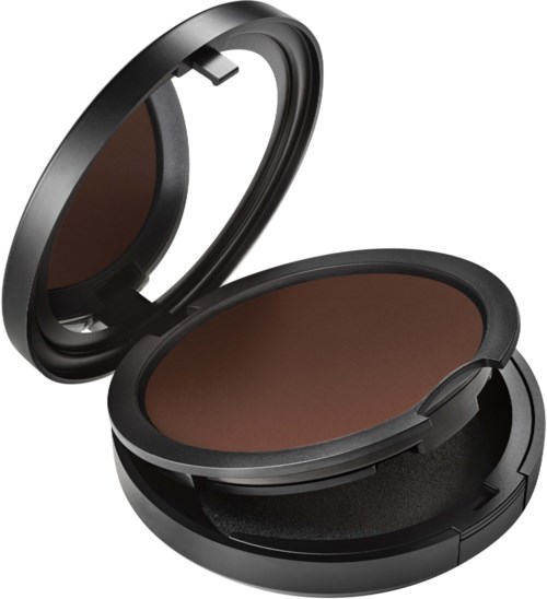 A compact makeup mirror and a large brown powder case, with a cushion inside, are shown. The mirror is open.