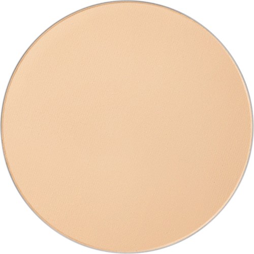 A large, round, beige-colored makeup compact, likely pressed powder, with a smooth, matte surface.