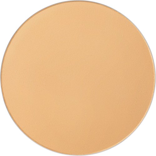 A round, beige-colored compact cushion, possibly makeup or powder, with a simple smooth surface.