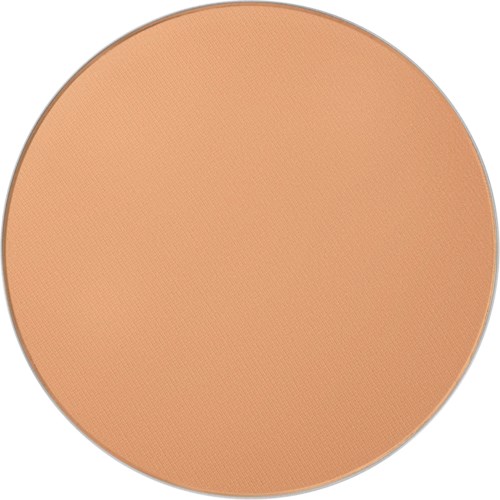 Ett runt kompakt med beige pressat puder med en slät yta.