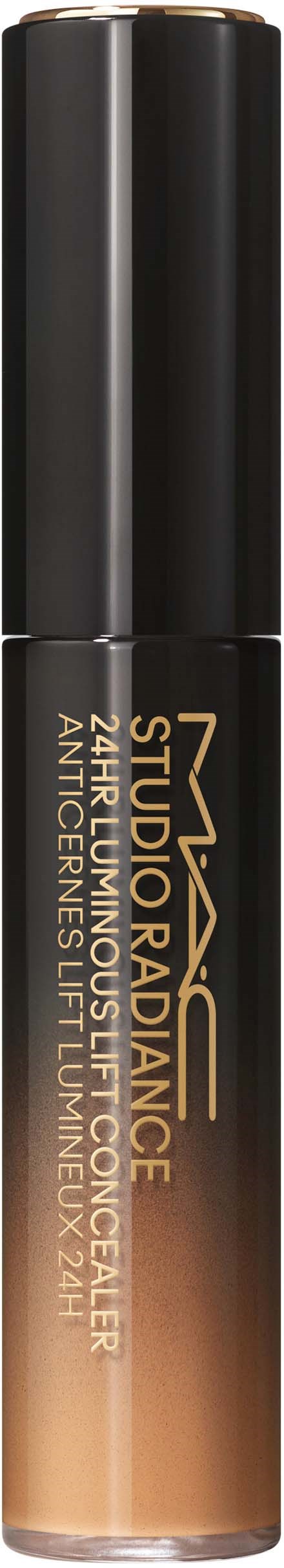 Een cilindrische container met een zwart deksel, gouden en zwarte label, en beige vloeistof binnenin. Het is een concealerstift.