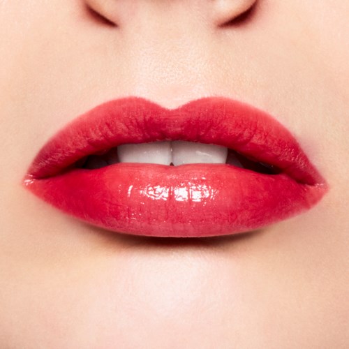 Close-up of lips with red lipstick, slightly parted showing teeth.