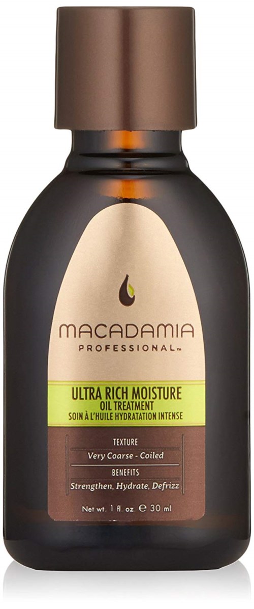 En mörkbrun flaska med brun kork, märkt Macadamia Professional Ultra Rich Moisture Oil Treatment.