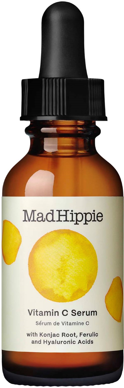 Mała butelka z kroplami oznaczona 'Mad Hippie Vitamin C Serum' z obrazkami pomarańczy i żółtych kół.