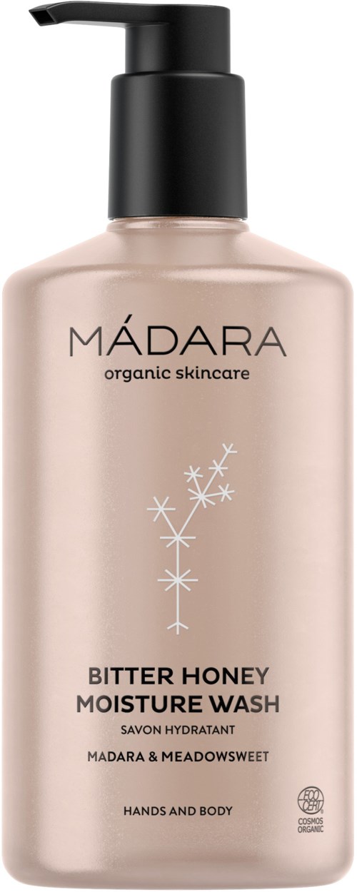 Eine beige Flasche mit schwarzem Pumpverschluss, beschriftet 'MADARA organic skincare,' mit der Aufschrift 'Bitter Honey Moisture Wash.'