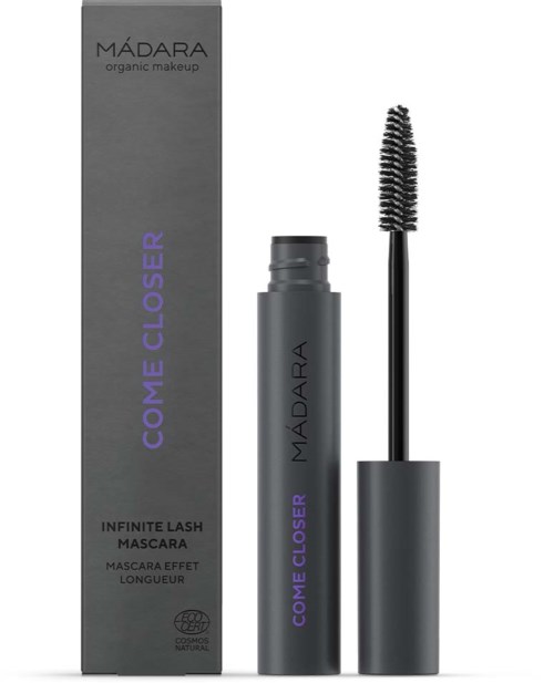 Eine Mascara-Flasche mit Pinsel und Verpackung, schwarze und lila Schrift, beworben wird "Come Closer" Mascara für lange Wimpern.