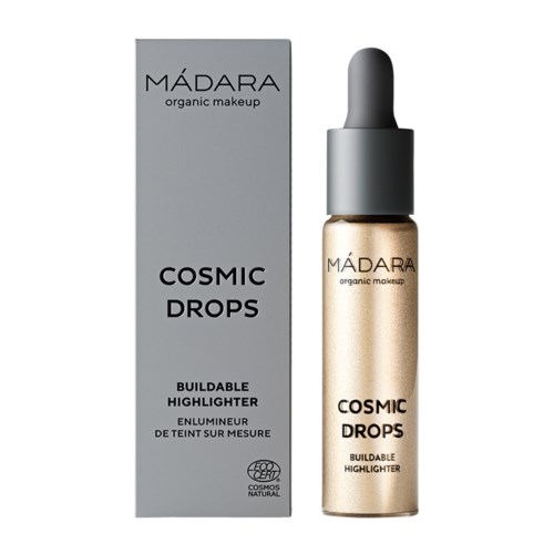 En låda och flaska med Madara Cosmic Drops, en byggbar highlighter märkt som ekologisk makeup.