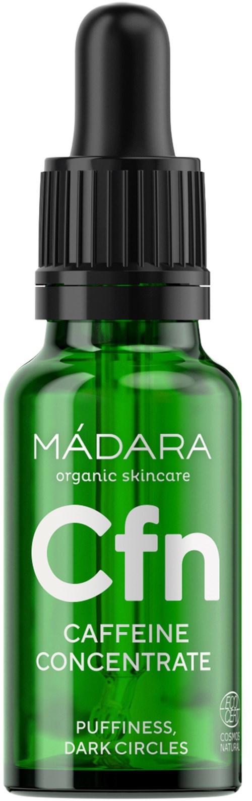 Grøn glasflaske med sort pippetilbehør, mærket 'MÁDARA Cfn Caffeine Concentrate,' med tekst om hudpleje og mørke cirkler.
