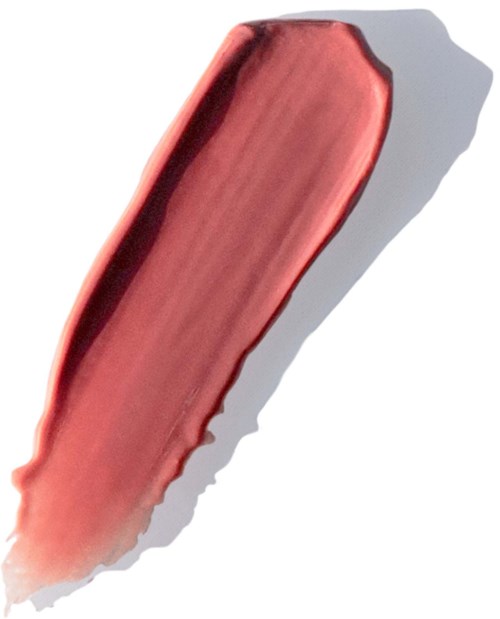 En provlapp av röd läppstift på vit bakgrund.