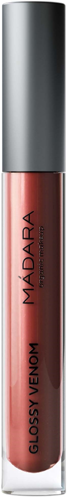 Ett rör med rosa-brun läppfärg, silverlock och "MADARA GLOSSY VENOM" skrivet på det.