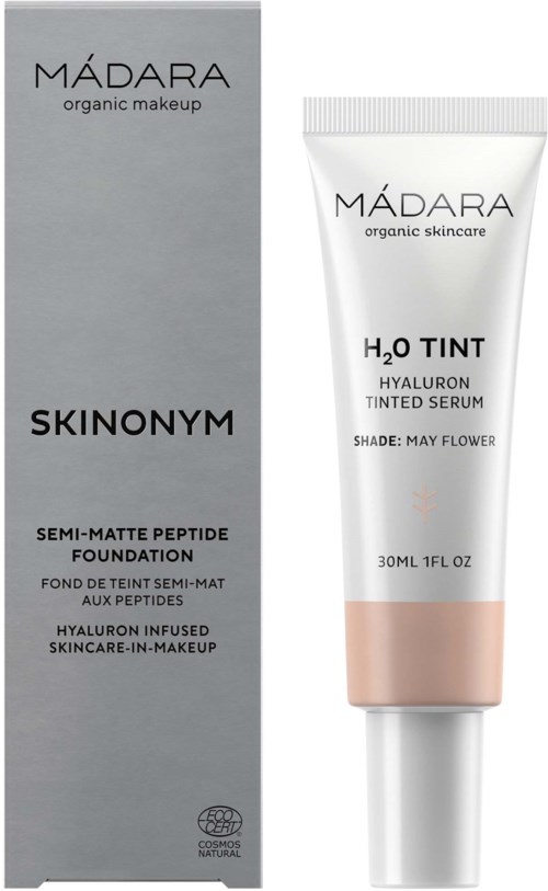 En produktboks og tube for Madara Skinonomy semi-matt foundation og tonet serum med hyaluronsyre, i grått og hvitt.