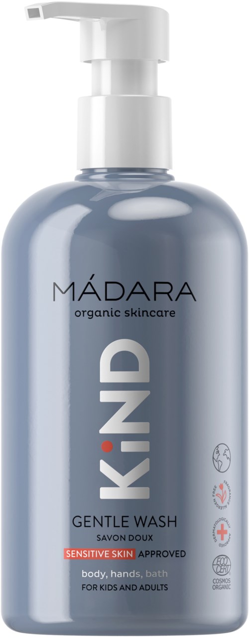 En blå flaske med hvit pumpe, merket "MÁDARA KIND" mild vask for sensitiv hud, for kropp, hender og bad.