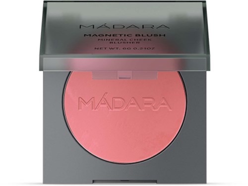 A round pink blush in a silver compact with the brand name 'MÁDARA' embossed on it.