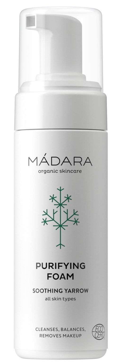 Een witte fles met pomp, gemerkt 'MÁDARA Purifying Foam' met een sneeuwvlokdesign. Het is voor huidreiniging.