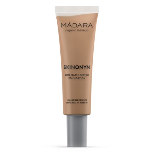 Beige rulla Mádara organics meikkituote SKINONYM-voideella, jossa on hopeinen kansi.
