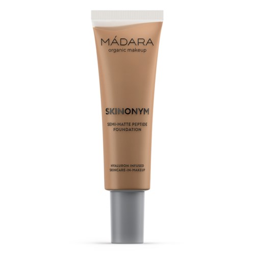 Beige-rakko, jossa on valkoinen suljettava, merkitty 'MÁDARA organic makeup' ja 'SKINONYM semi-matte foundation.'