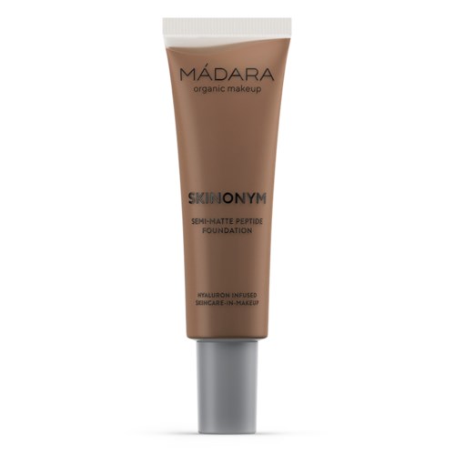 Herkänsäytelapputuotteen putkilo, jossa lukee 'MÁDARA' ja 'SKINONYM' ja 'semi-matte peptide foundation'.