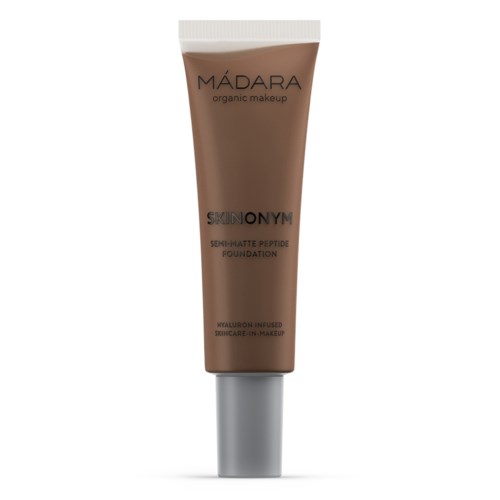 Ruskeassa putkissa hopeanvärinen korkki, leimattu 'MÁDARA organic makeup'. Siitä löytyy teksti 'SKIN ON YIM'.