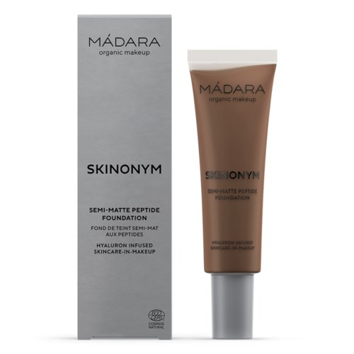 Laatikko ja putki MÁDARA Skinonym semi-matte peptide -meikkivoidetta, merkitty hyaluronihapon infuusiona, ekologinen meikki, jolla on ihonhoidollisia etuja.