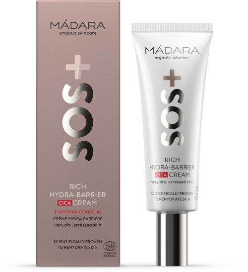 En hudpleieprodukt kalt SOS Rich Hydra-Barriere Cica Cream for tørr, stresset hud, med emballasje og tube i hvitt og rosa.