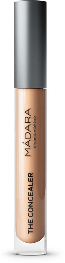 Abdeckungstube mit der Aufschrift 'MÁDARA THE CONCEALER' mit silberner Kappe und beigefarbener Substanz.