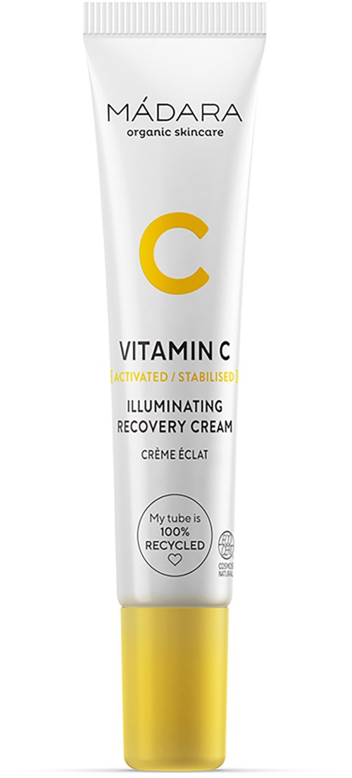 Eine weiße Tube mit gelbem Verschluss, gekennzeichnet als MÁDARA Vitamin C aufhellende Erholungscreme.