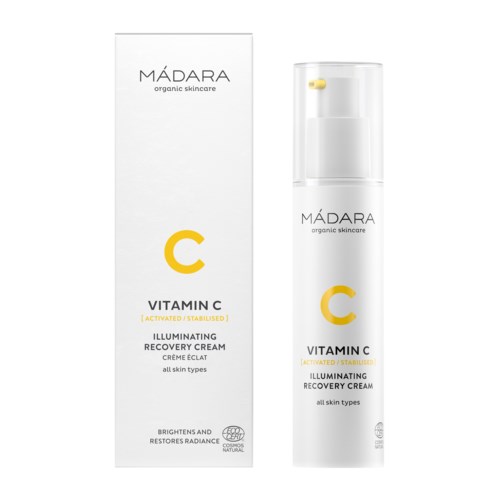 A white box and a bottle of Mádara Vitamin C illuminating cream for all skin types.