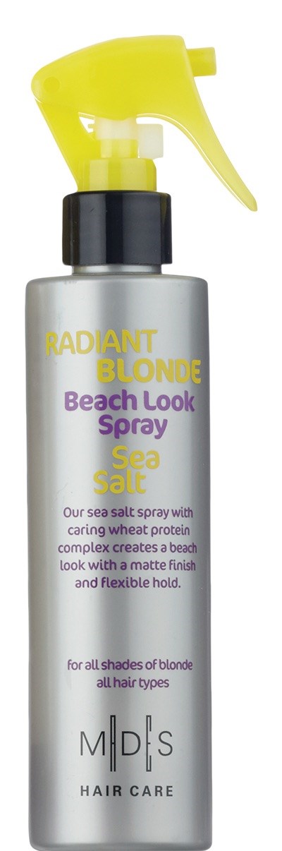 En silver sprayflaska med gul sprayhatt märkt 'Radiant Blonde Beach Look Spray' för blont hår.