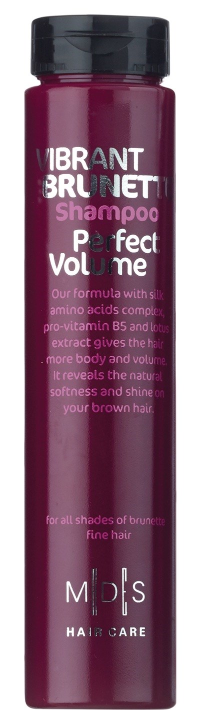 En lang, lilla flaske med sort låg, mærket som VIBRANT BRUNETTE Shampoo for perfekt volumen, indeholder vitaminer og naturlige ekstrakter.