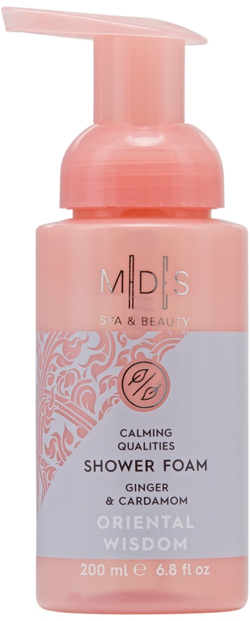 Rosa duschskumflaska med pump, märkt med varumärke och produktdetaljer, inklusive ingefära och kardemumma.