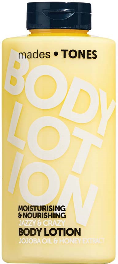 A yellow bottle labeled 'Body Lotion' with black cap, mentions moisturizing, nourishing, jojoba oil, and honey extract.