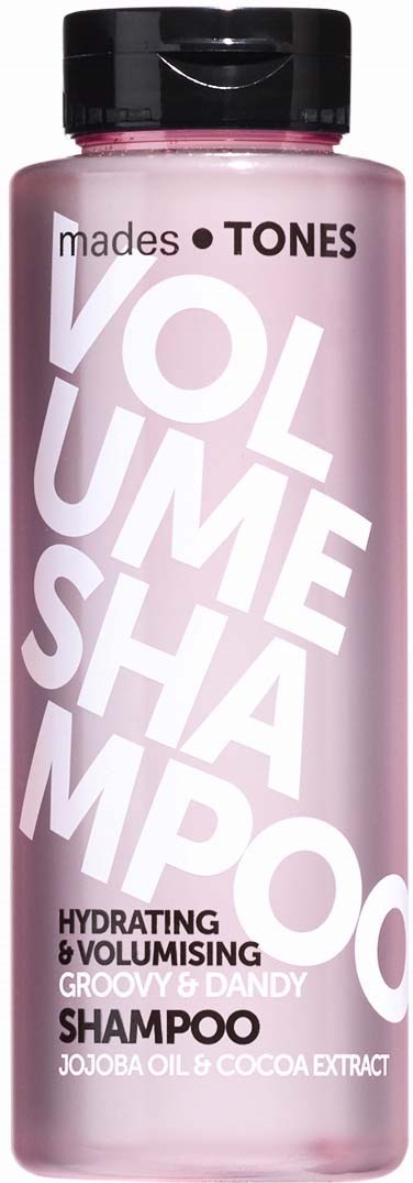 Pink sjampo på flaske med svart lokk, merket 'Volume Shampoo' for fuktighetsgivende og volumbringende hår.
