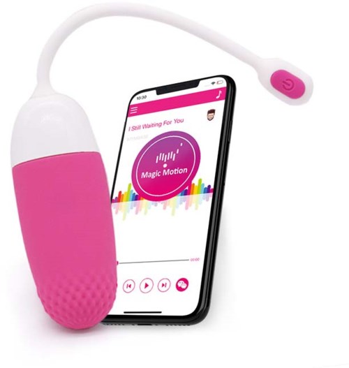 Ein pinkes und weißes Gerät, das mit einem Smartphone verbunden ist, spielt Musik oder Töne.