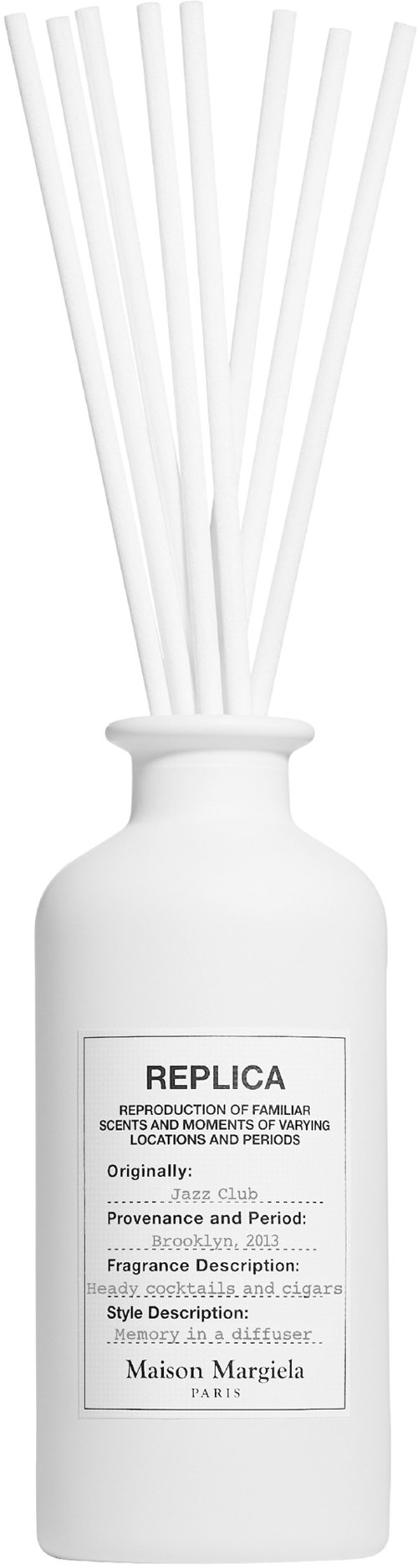 Weiße Diffusorflasche mit Stäbchen und einem Etikett mit Produktdetails und Markennamen.