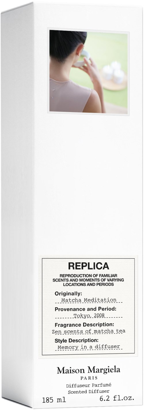 A tall white box with a photo of a woman on the top and text about perfume at the bottom.