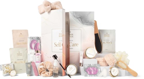 Beauty products and skincare items arranged attractively with a large gift box in the background.