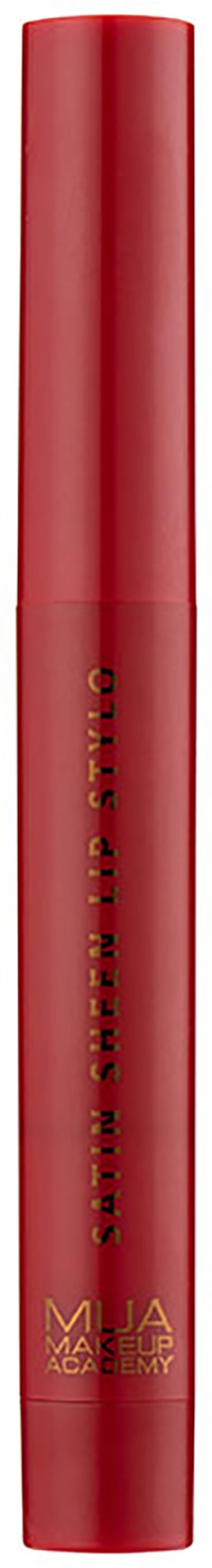 Red cylindrical makeup product with gold text and logo, standing vertically on a black background.