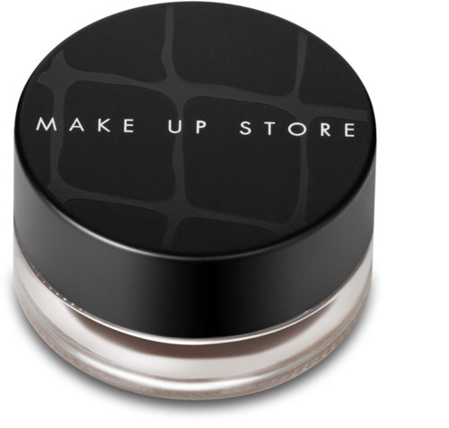En liten rund behållare med svart lock som har texten "MAKE UP STORE" i vitt.
