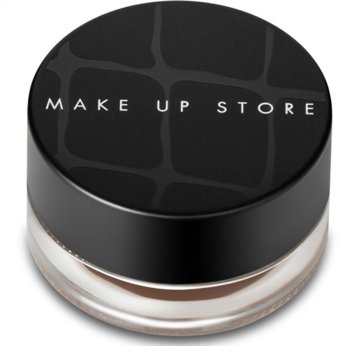 Svart runt förpackning med texten 'MAKE UP STORE' på locket. Det innehåller sannolikt makeup eller kosmetika.