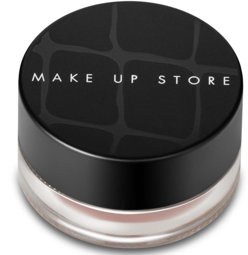 En rund svart lock med vitt text som säger "MAKE UP STORE" och ett svagt mönster på toppen.