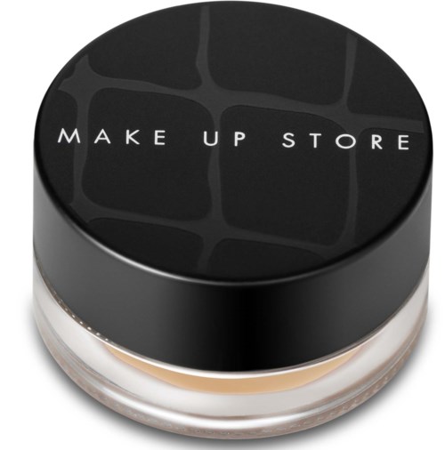 En rund makeup-ask med svart lock och texten "MAKE UP STORE" på toppen.