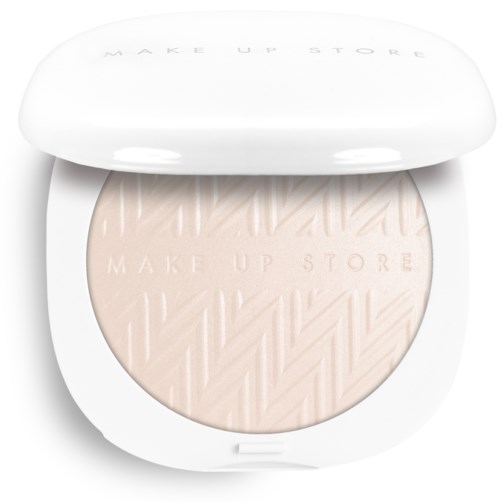 A compact face powder with a textured pattern and the brand name Make Up Store embossed on the surface.